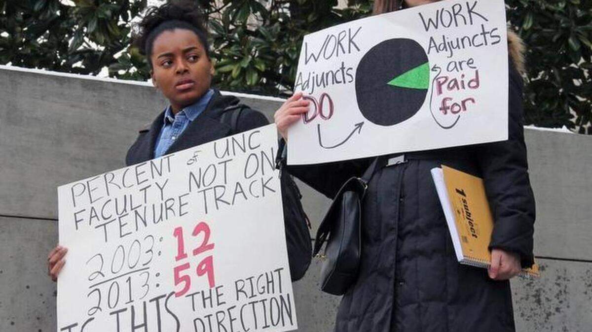 Instructors and students rally for higher pay for adjunct faculty members at UNC-Chapel Hill on the steps of Wilson Library on Wednesday, Feb. 25, 2015.