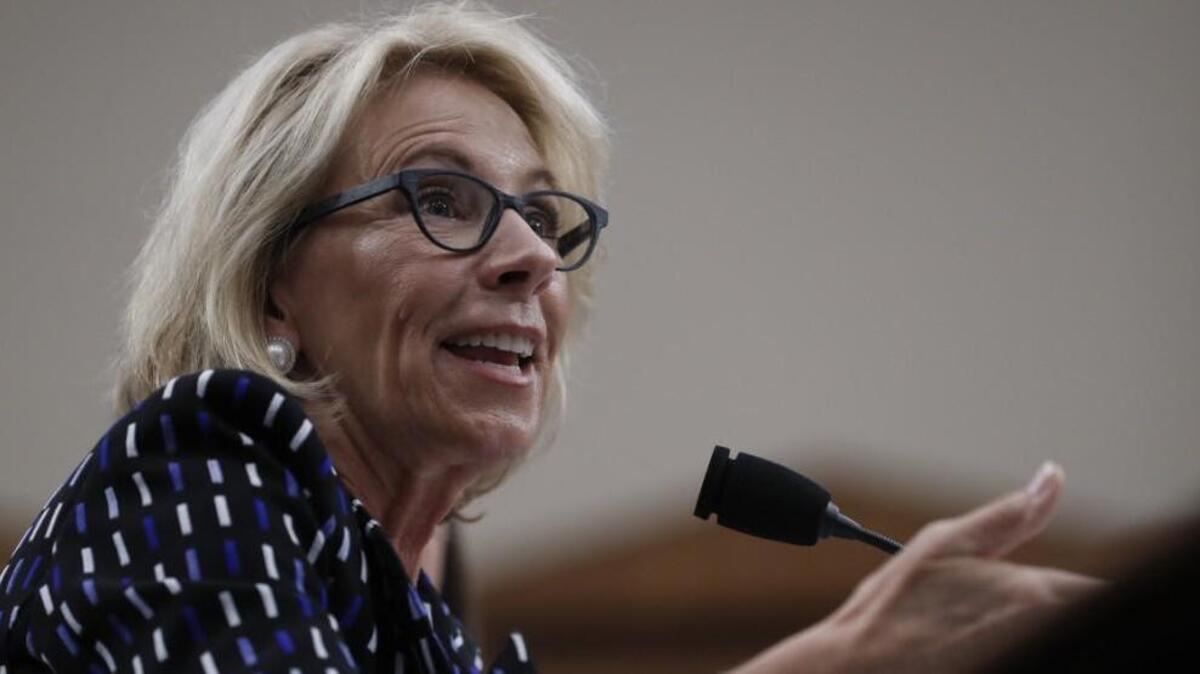 Education Secretary Betsy DeVos testifies on Capitol Hill in Washington. She favors using public funds to support private schools.