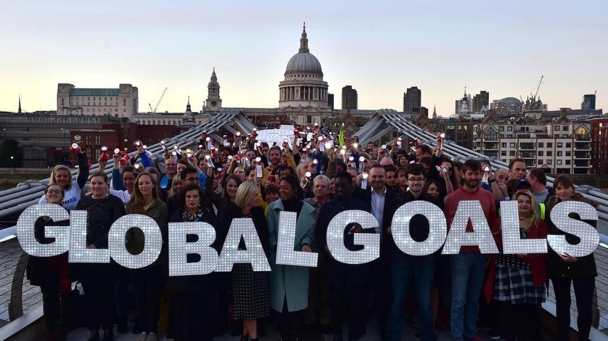 
Activists stand on the Millennium bridge in London to demand action on poverty, inequality and climate change on the eve of a United Nations summit.
