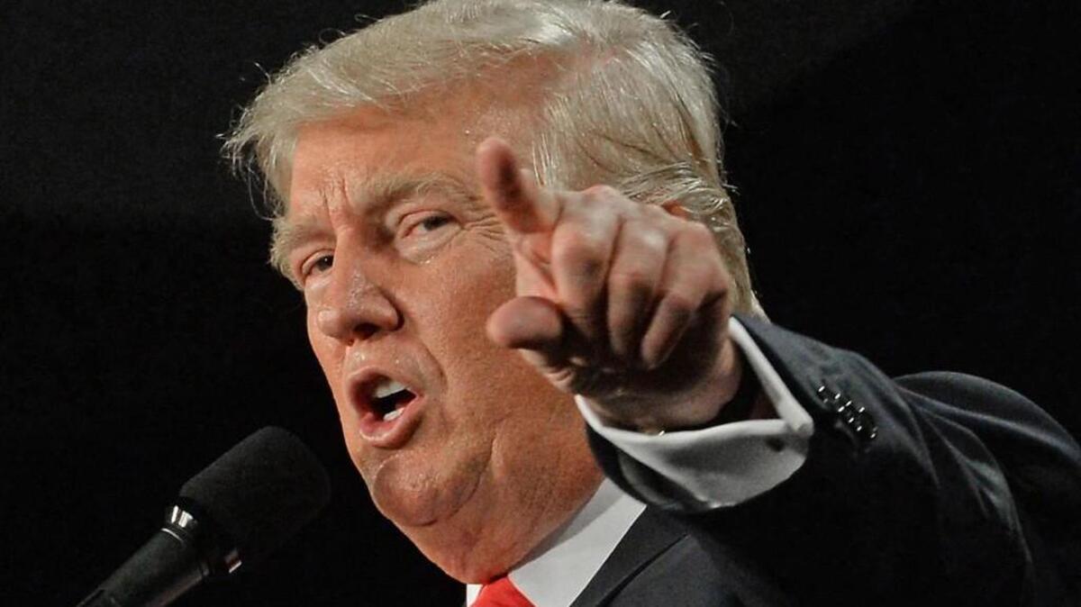 Republican Presidential candidate Donald Trump gestures as he speaks to the crowd during a 50 minute speech at the Dixie Classic Fairgrounds Annex in Winston-Salem on July 25.