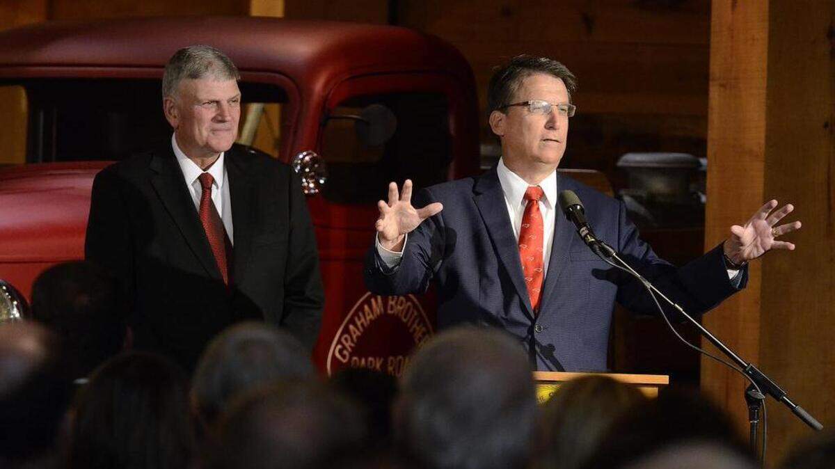 
Gov. Pat McCrory, with Franklin Graham at his side, addresses guests at the Billy Graham Library after signing a law that calls for replacing a statue of N.C. Gov. Charles Aycock with one of Billy Graham at the U.S. Capitol in Washington.
