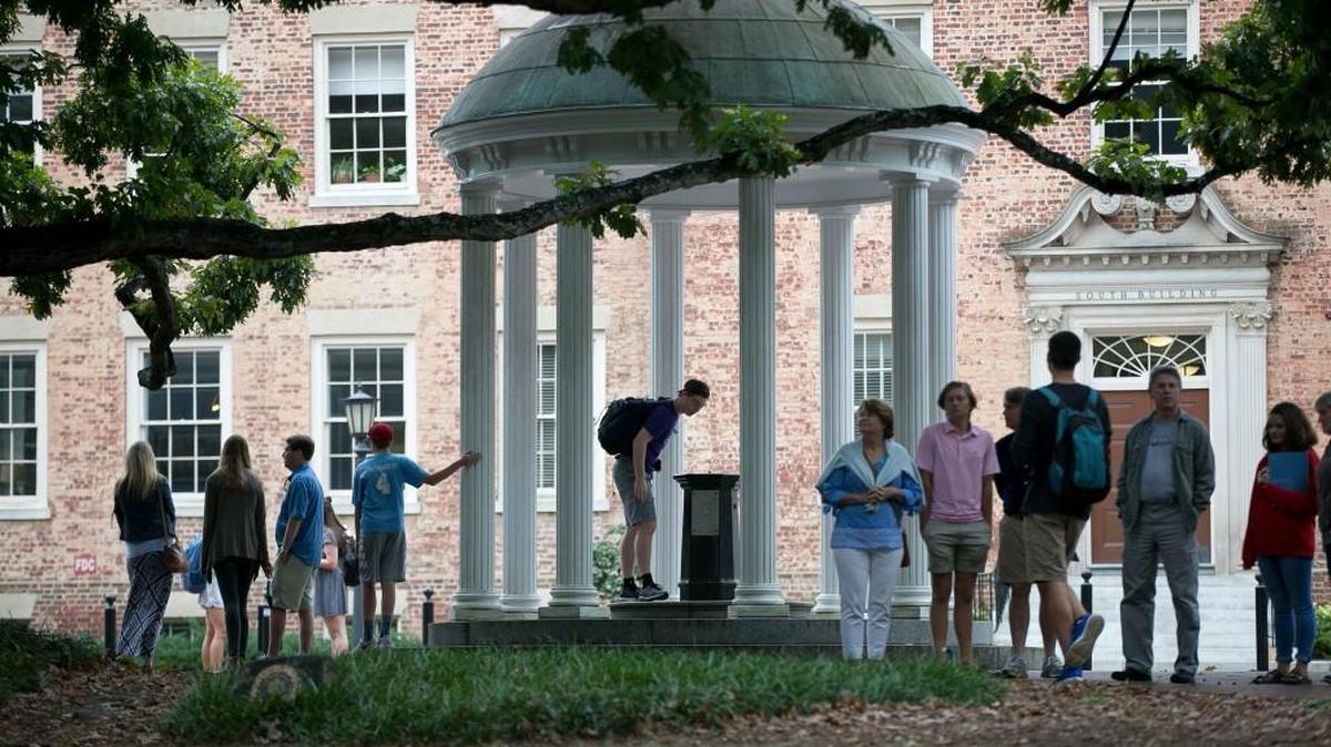 A steady stream of visitors and students visit the Old Well on the University of North Carolina campus on Friday, October 13, 2017.