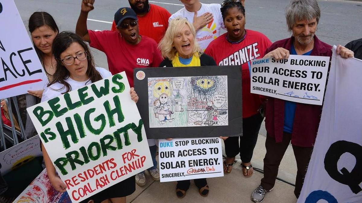 Members of environmental organizations and social justice groups rally outside Duke Energy’s annual shareholder meeting in 2015.