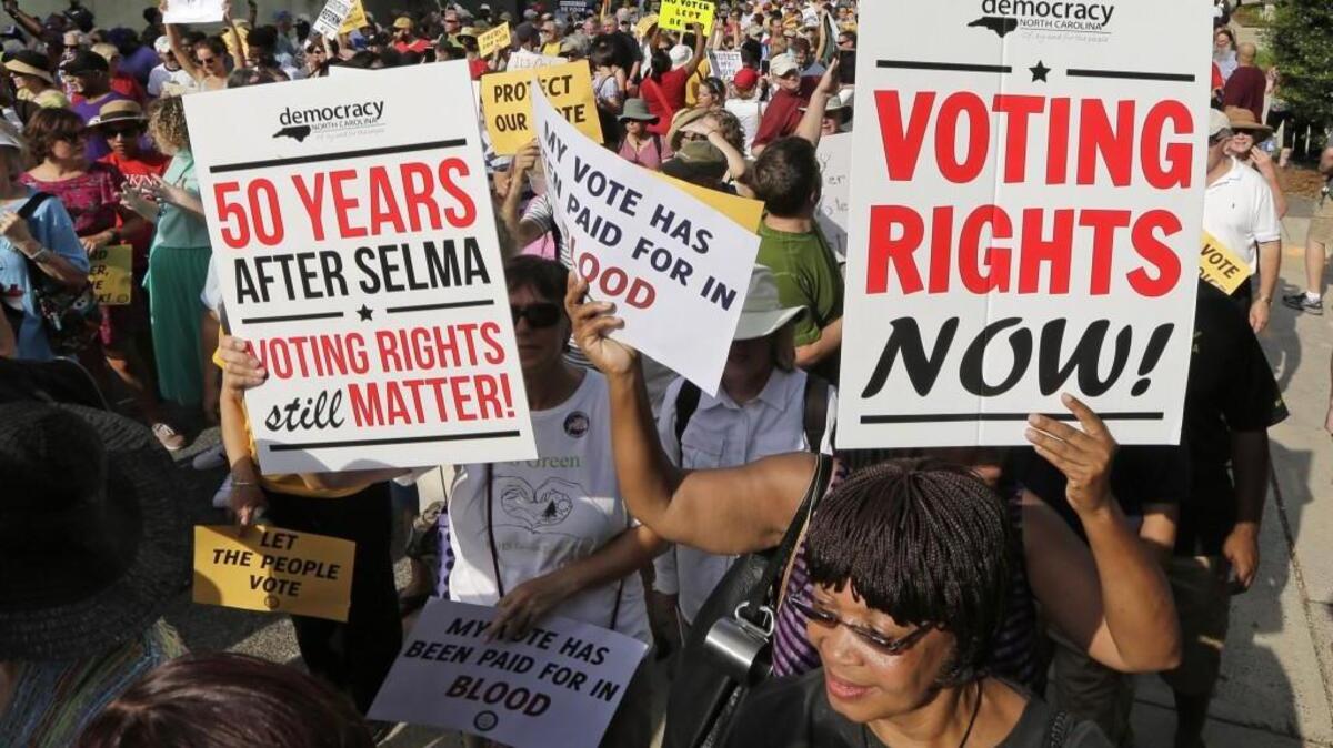 
Demonstrators march in Winston-Salem to oppose a 2013 state election reform law.
