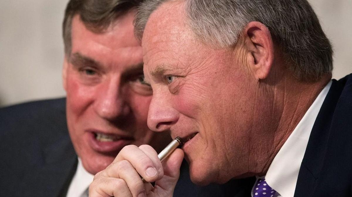 Senate Intelligence Committee Chairman Richard Burr (R-NC) (R) and ranking member Sen. Mark Warner (D-VA) talk during a hearing with the heads of the U.S. intelligence agencies in the Hart Senate Office Building on Capitol Hill May 11, 2017 in Washington, DC. The intelligence officials were questioned by the committee during the annual hearing about world wide threats to United States’ security.