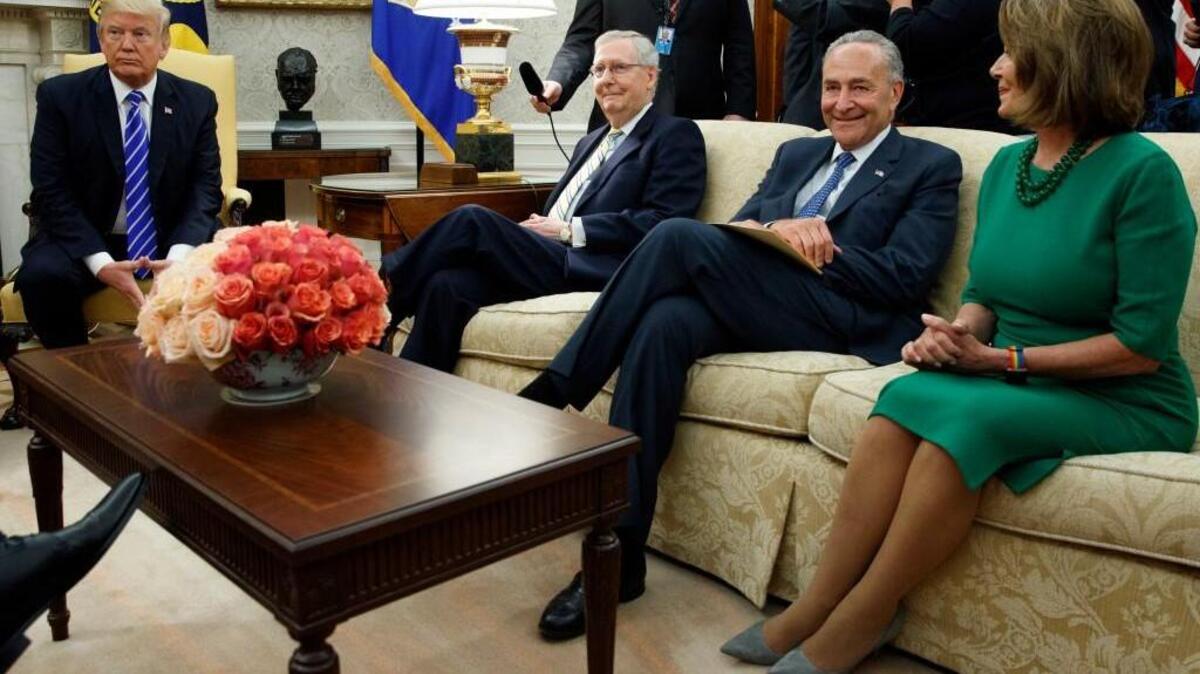 In this Sept. 6, 2017, photo, President Donald Trump pauses during a meeting with, from left, Senate Majority Leader Mitch McConnell, R-Ky., Senate Minority Leader Chuck Schumer, D-N.Y., House Minority Leader Nancy Pelosi, D-Calif., and other Congressional leaders in the Oval Office of the White House, Wednesday, Sept. 6, 2017, in Washington.