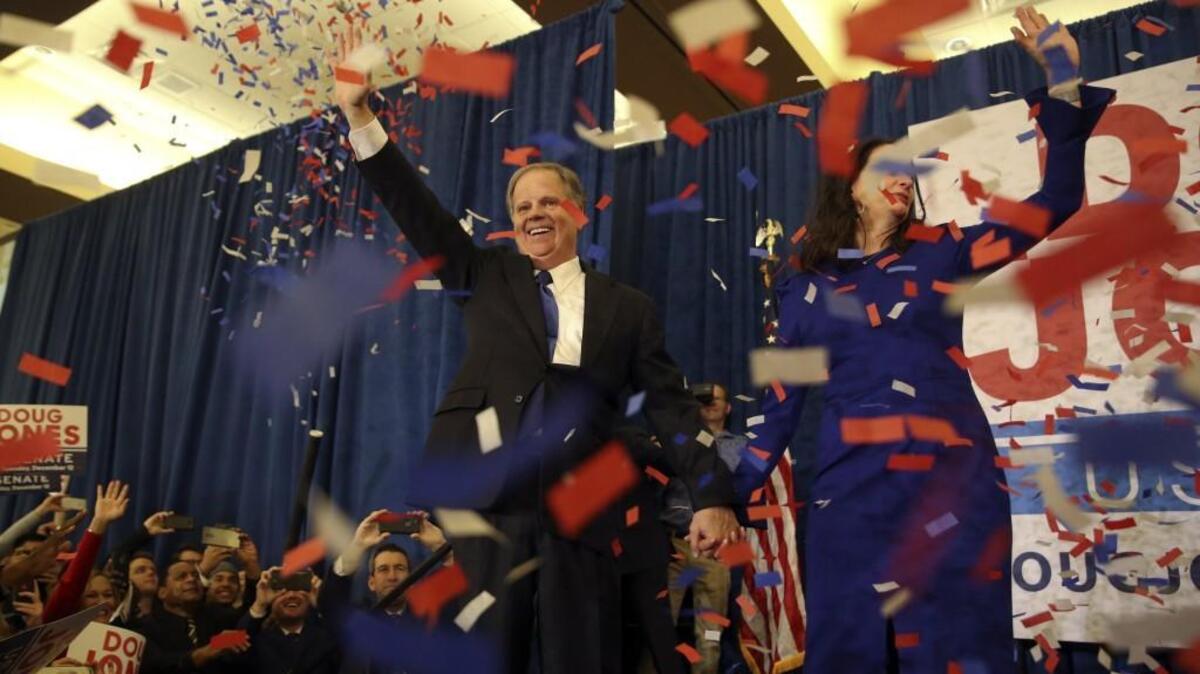 In this Tuesday, Dec. 12, 2017, file photo, democratic candidate for U.S. Senate Doug Jones and his wife Louise wave to supporters before speaking during an election-night watch party in Birmingham, Ala.. The race for a U.S. Senate seat turned upside down when Republican candidate Roy Moore was confronted with allegations of sexual misconduct involving teenage girls decades ago when he was in the 30s. Moore had been considered the frontrunner but ultimately lost to Democrat Jones.