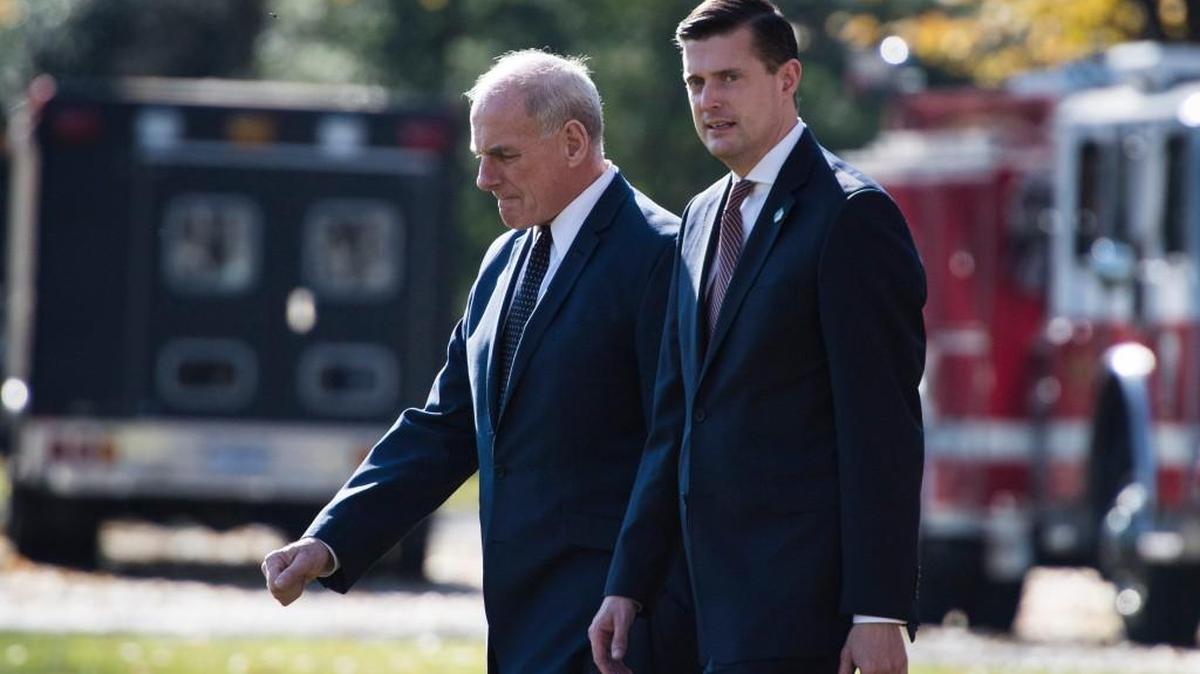Rob Porter, right, was the right-hand man for White House Chief of Staff John Kelly, left, in the West Wing. The two are pictured above walking to Marine One in November 2017.
