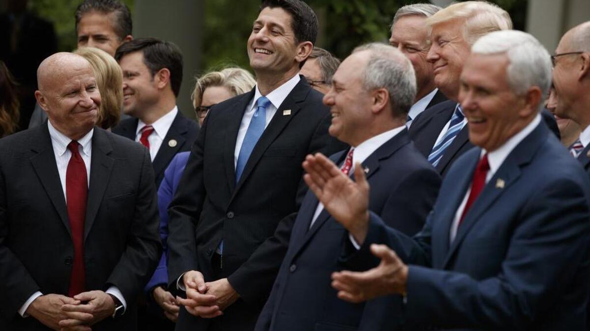 President Donald Trump, accompanied by GOP House members in the Rose Garden of the White House, cheer for Speaker of the House Rep. Paul Ryan, R-Wis., after the House pushed through a health care bill repealing parts of the Affordable Care Act. Ryan also hopes to make Medicare into a privately managed health care insurance plan.
