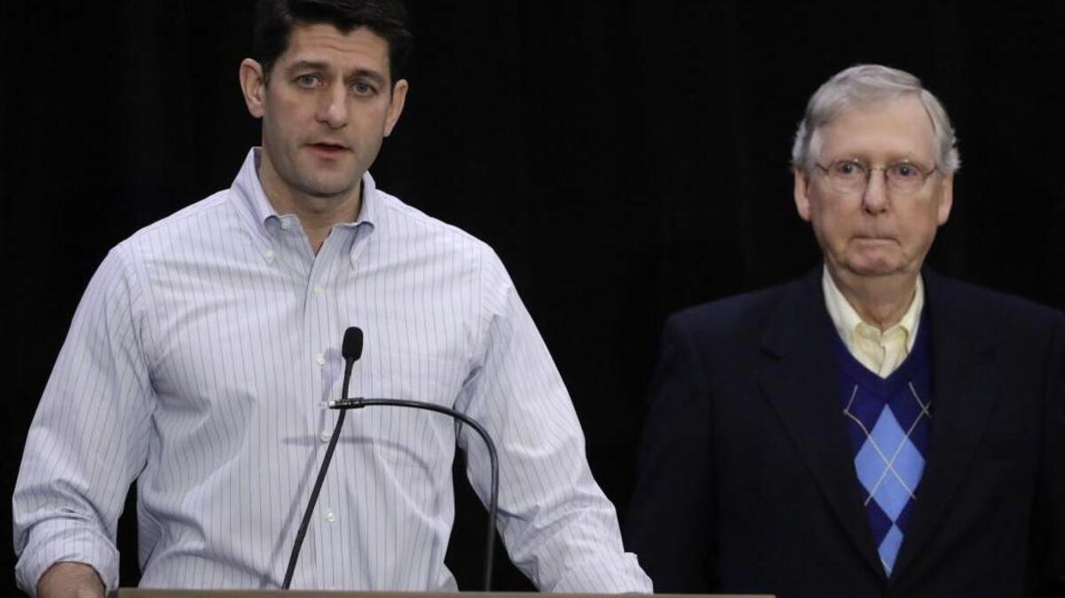 House Speaker Paul Ryan of Wis., left, accompanied by Senate Majority Leader Mitch McConnell of Ky., speaks at the Republican congressional retreat in Philadelphia on Jan. 26, 2017.