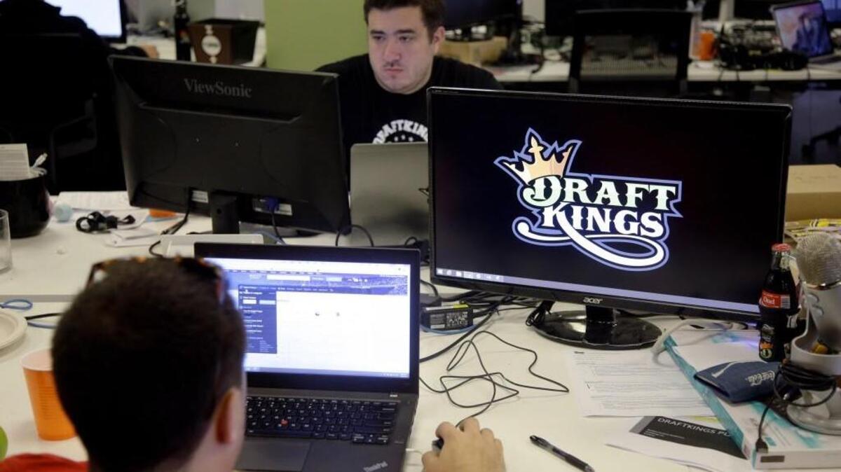 
Len Don Diego, marketing manager for content at DraftKings, a daily fantasy sports company, works at his station at the company’ offices in Boston. The daily fantasy sports industry is eying a breakout NFL season. And its two dominant companies, DraftKings and FanDuel, touted lucrative opening week prizes to try to draw more customers as more competitors pop up.
