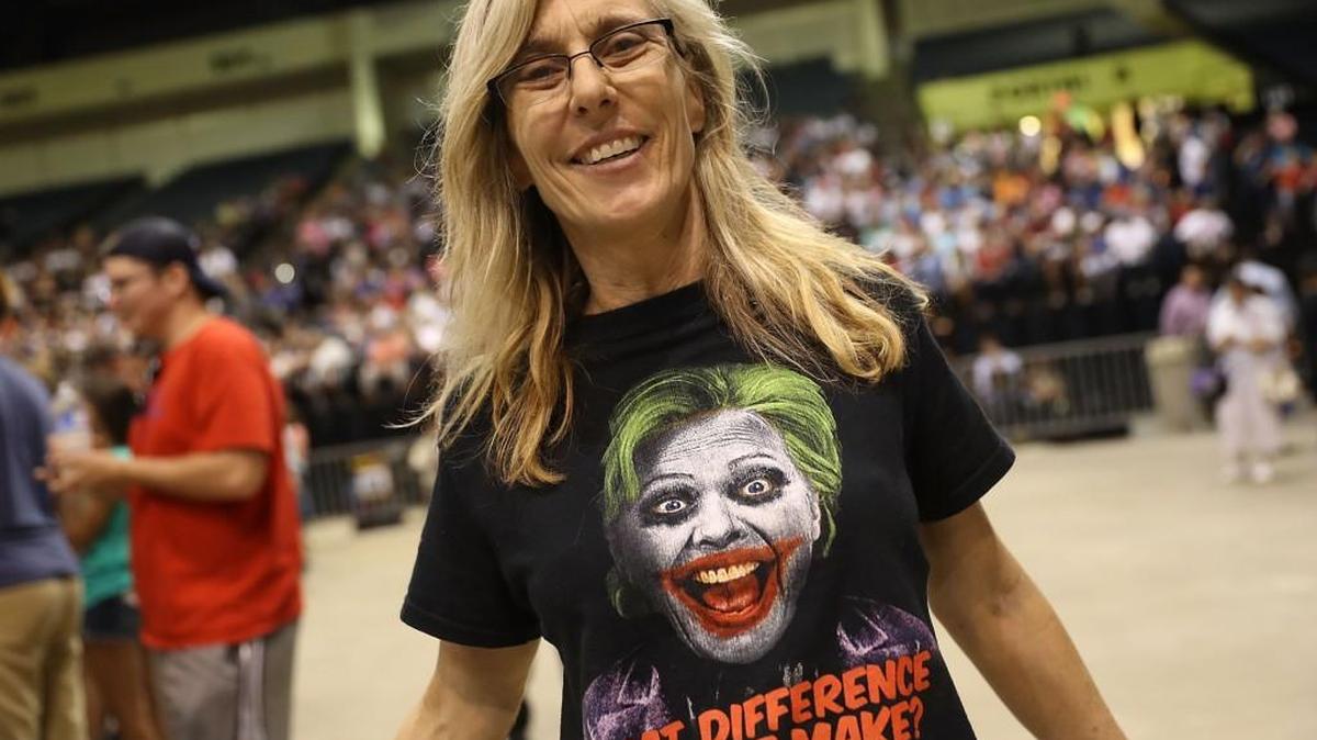 Lori Lewis waits for the arrival of Republican presidential nominee Donald Trump during his campaign event at the Ocean Center Convention Center in Daytona, Florida.