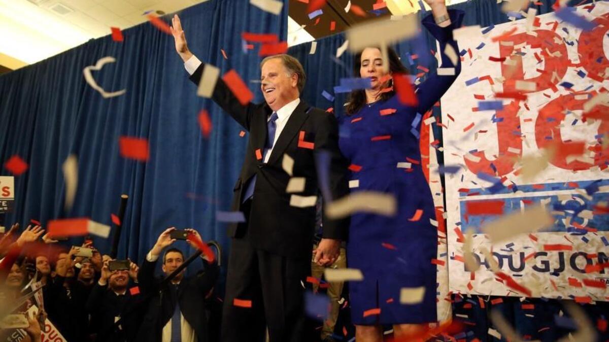 Democratic candidate for U.S. Senate Doug Jones and his wife Louise wave to supporters before speaking during an election-night watch party Tuesday, Dec. 12, 2017, in Birmingham , Ala. Jones defeated Republican Roy Moore.