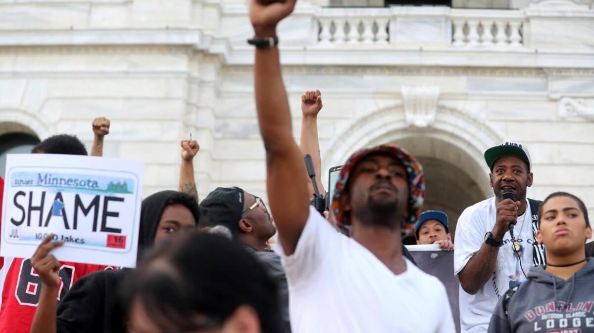 John Thompson, upper right, a friend of Philando Castile, talks outside the state Capitol in St. Paul, Minn., after the police officer who fatally shot Castile during a traffic stop last year was found not guilty of second-degree manslaughter on June 16.