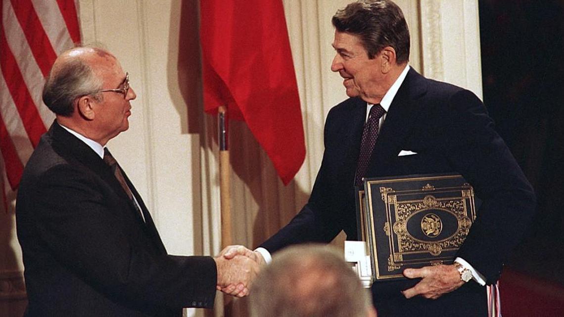 U.S. President Ronald Reagan, right, shakes hands with Soviet leader Mikhail Gorbachev after the two leaders signed the Intermediate Range Nuclear Forces Treaty to eliminate intermediate-range missiles during a ceremony in the White House East Room in Washington on Dec. 8, 1987.