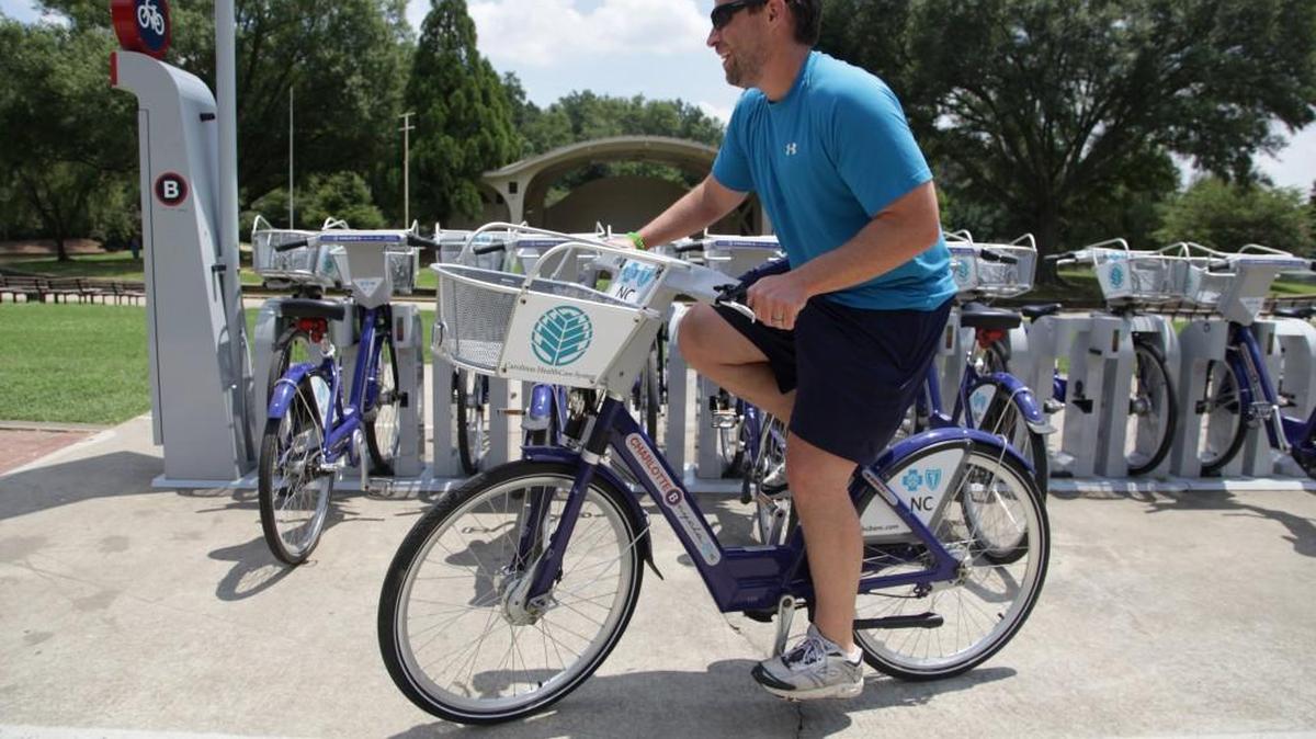 Andy Mock takes a bike for a ride from the Charlotte B-cycle station at Freedom Park. “These bikes saved me. I used to have to take my bike to work, which was kind of a hassle,” says Mock. He purchased a yearlong membership so he can use the bikes whenever he needs them. Charlotte B-cycle is a bike sharing system with 200 bicycles and 20 stations spread out around Charlotte.