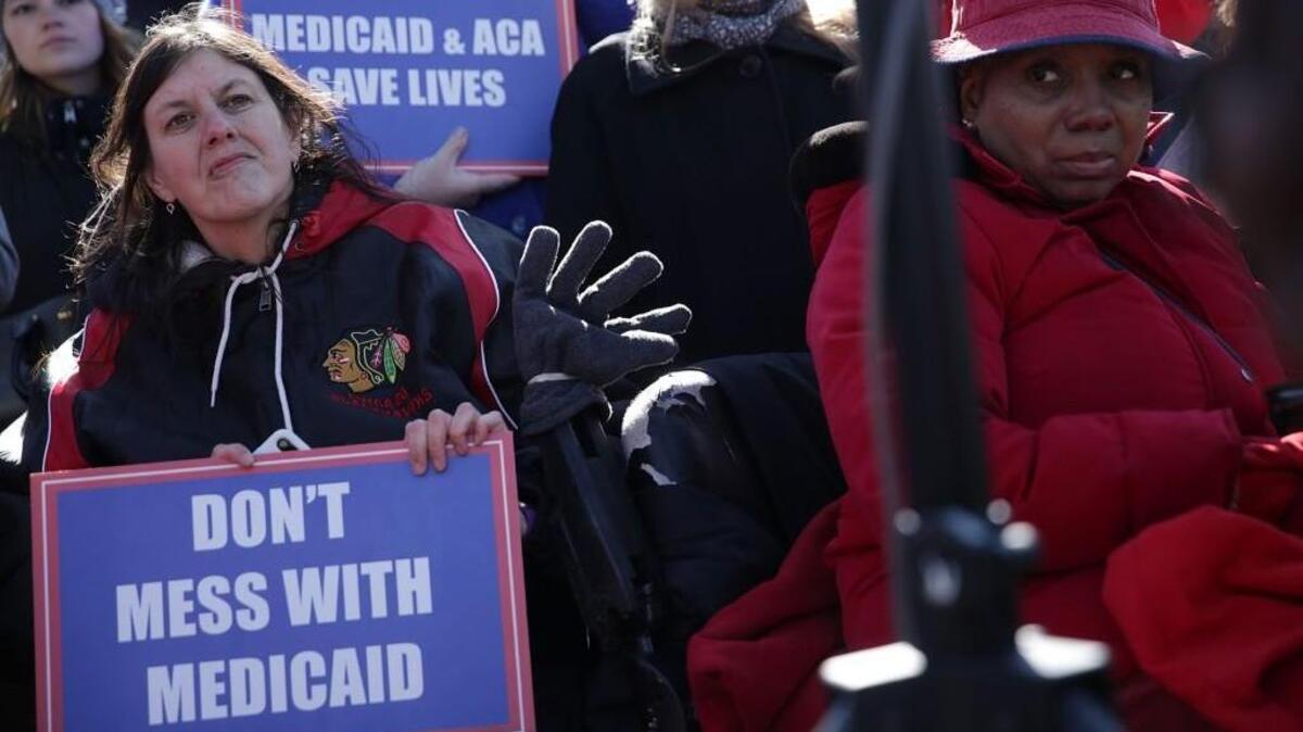 Health care activists participate in a rally in front of the Capitol March 22, 2017 on Capitol Hill in Washington, DC. Senate Democrats held the rally to highlight changes being sought in Medicaid in the Republican American Health Care Act.