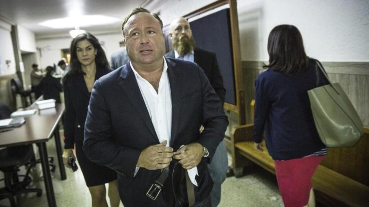 In this April 17 photo, “Infowars” host Alex Jones arrives at the Travis County Courthouse in Austin, Texas, as part of a child custody battle. Jones, who has called the Sandy Hook massacre a hoax, is scheduled to appear on Megyn Kelly’s Sunday TV show. Some advertisers are reportedly pulling ads to protest of Kelly’s giving Jones a wider stage.