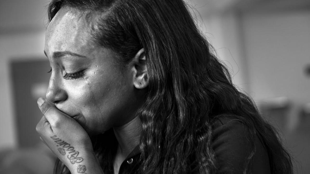 Clenesha Garland, 24, fights back tears during a visit with her mom Sharanda Jones at Carswell Federal Prison in Fort Worth, Texas. Jones, a first time nonviolent offender, is serving life in prison without parole for a drug conspiracy conviction.
