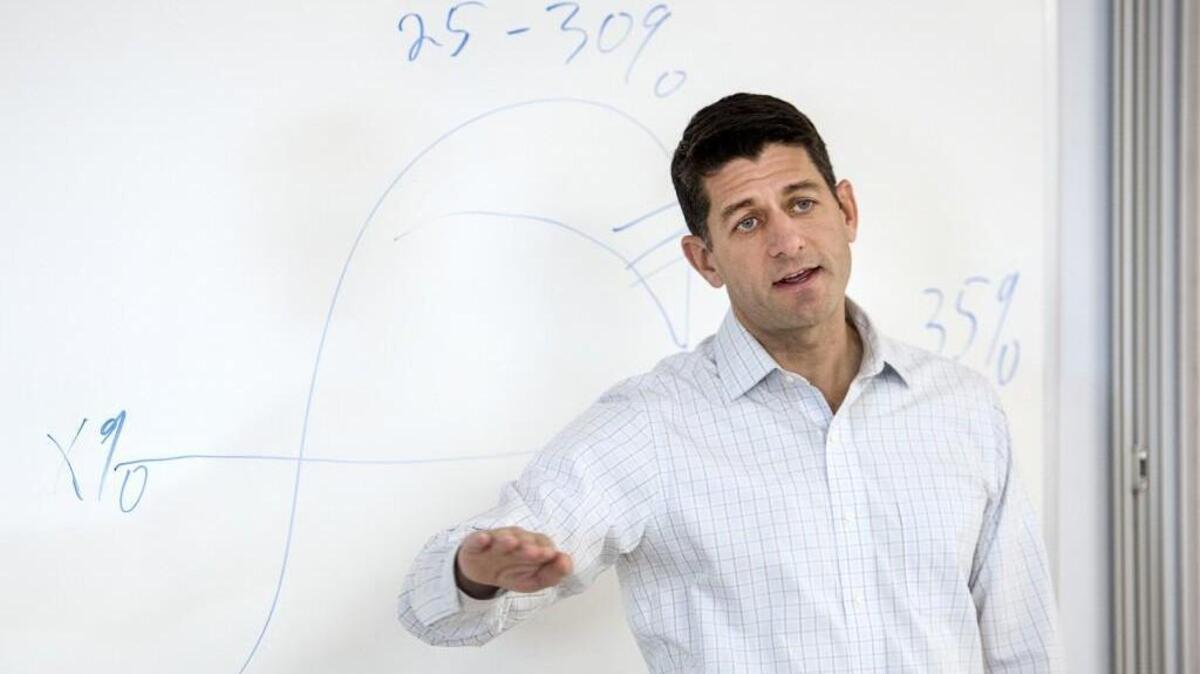 House Speaker Paul Ryan uses a chart he drew to explain corporate tax, Monday, Oct. 16, 2017, during a question and answer session for Evonik employees at their production plant in Janesville, Wis.