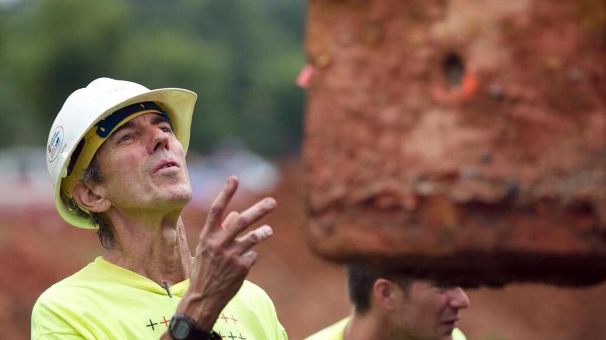Raleigh artist Thomas Sayre supervises the placement of one of his eight pieces of sculpture on a tractor trailer on Tuesday, August 12, 2014 at The Cypress of Raleigh retirement community in Raleigh, N.C.