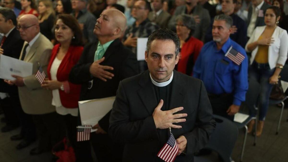 Rafael Garcia, originally from Cuba, becomes an American citizen during a ceremony at the U.S. Citizenship and Immigration Service's Kendall office on November 10 in Miami, Florida. Across the nation more than 7,500 new citizens in more than 40 naturalization ceremonies were sworn in last last Thursday as the agency honored Veterans Day during the ceremonies.