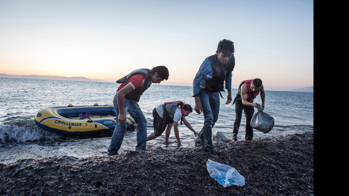 
Four Afghan men hardly able to stand up arrive by small dinghy and find an approaching army as they accidentally landed on a Greek army base. 
