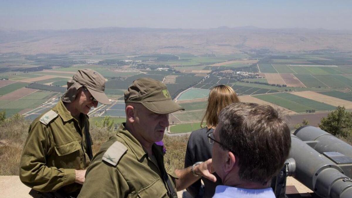 
US Defense Secretary Ashton Carter talks with Israel Defense Forces while viewing the Hula Valley from the Hussein Lookout near Kiryat Shmona, in northern Israel. Carter visited Israel in a bid to ease concerns over the nuclear deal with Iran.
