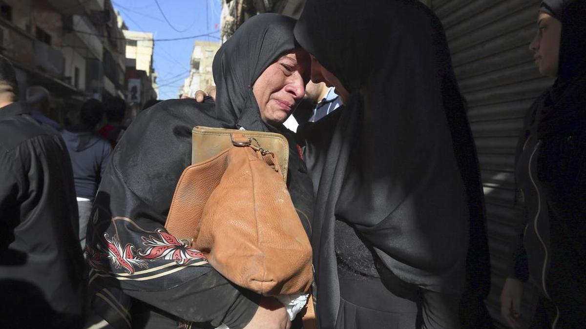 Lebanese women weep at the scene of twin suicide bombings in Burj al-Barajneh, southern Beirut, Lebanon. More than 40 people were killed last week.