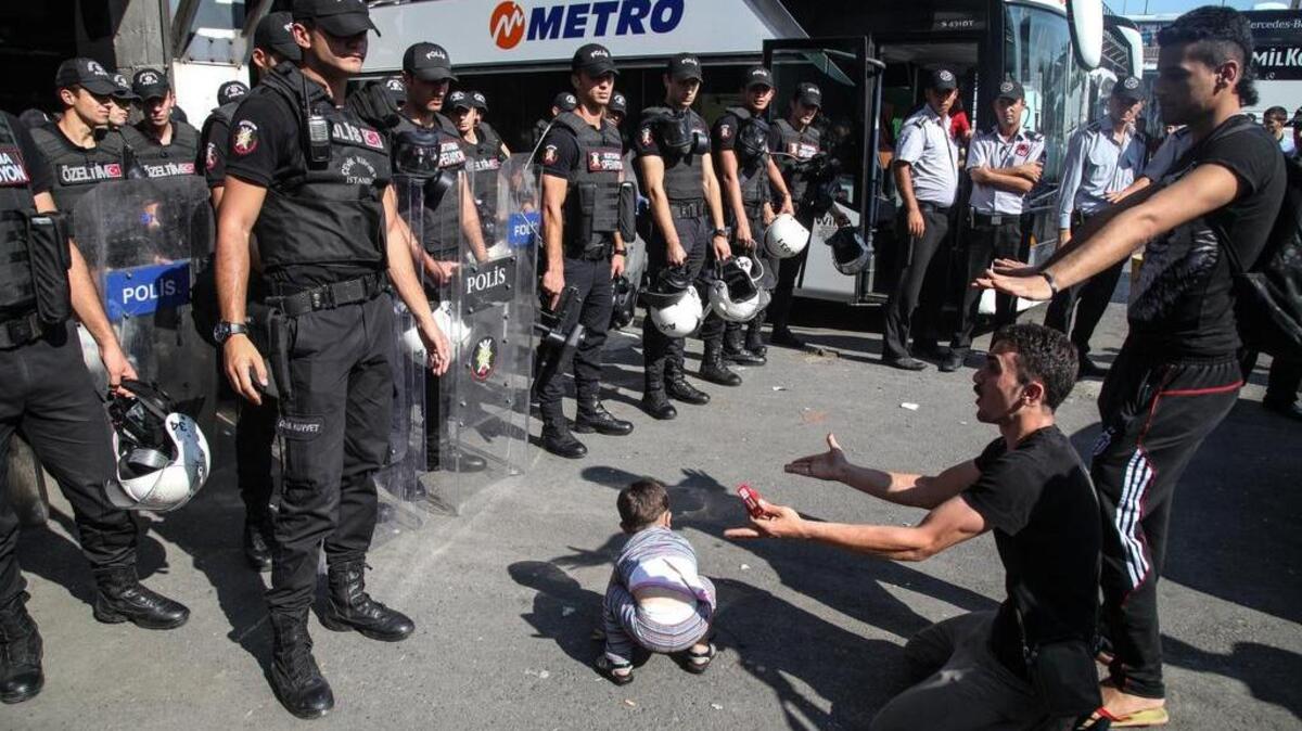 
Turkish riot police stand guard as migrants and refugees protest their wait at Istanbul’s Esen Bus Terminal for buses to the Turkish-Greece border as authorities withhold tickets to Turkish border towns.

