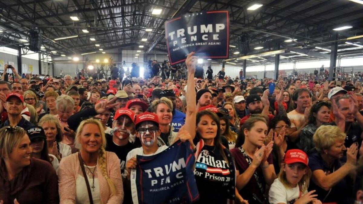 Supporters of Republican Presidential nominee Donald Trump cheer for him during a campaign rally at the Jefferson County Fairgrounds - Rodeo Arena & Event Center in Golden, Colorado on Saturday.