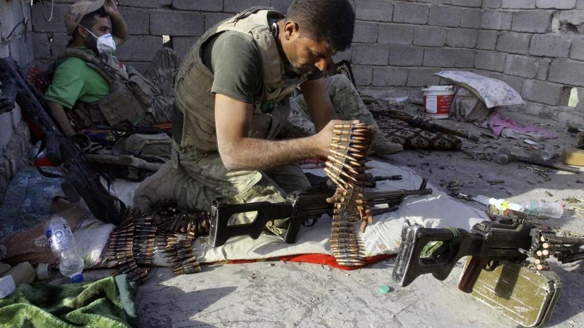 An Iraqi soldier assembles his weapons during clashes in Fallujah, Iraq. Fallujah has been locked in a cycle of conflict since 2003, when it emerged as a bastion of the insurgency against the Americans. Militant attacks and bombings were followed by sweeping arrest raids, which further stoked local grievances. In 2004, U.S. troops launched two massive assaults on the city, where they fought their bloodiest battles since Vietnam.