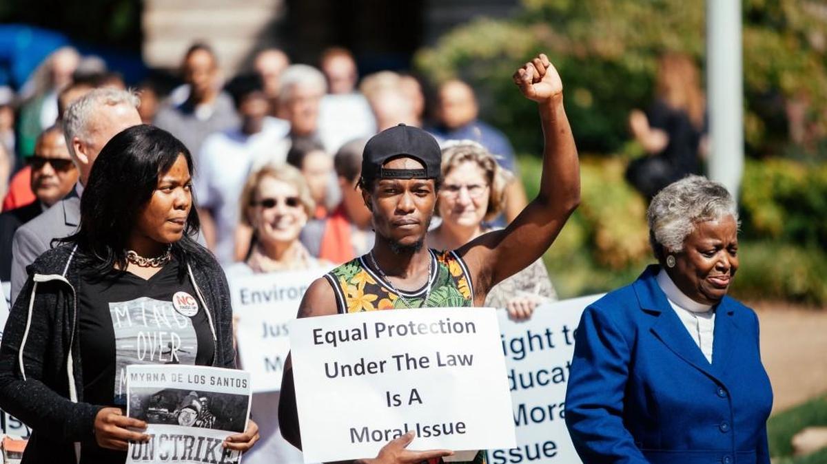 Protestors march to the North Carolina Capitol Building during a Moral Monday protest in Raleigh on Monday, Sept. 12, 2016.