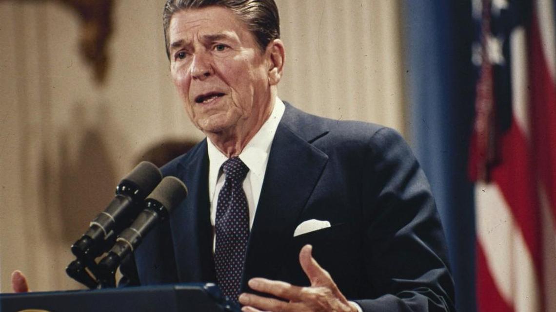 In this Oct. 19, 1983 file photo, President Ronald Reagan speaks during a news conference at the White House in Washington. A draft glossary of social studies terms for North Carolina public schools misspelled Reagan’s name.
