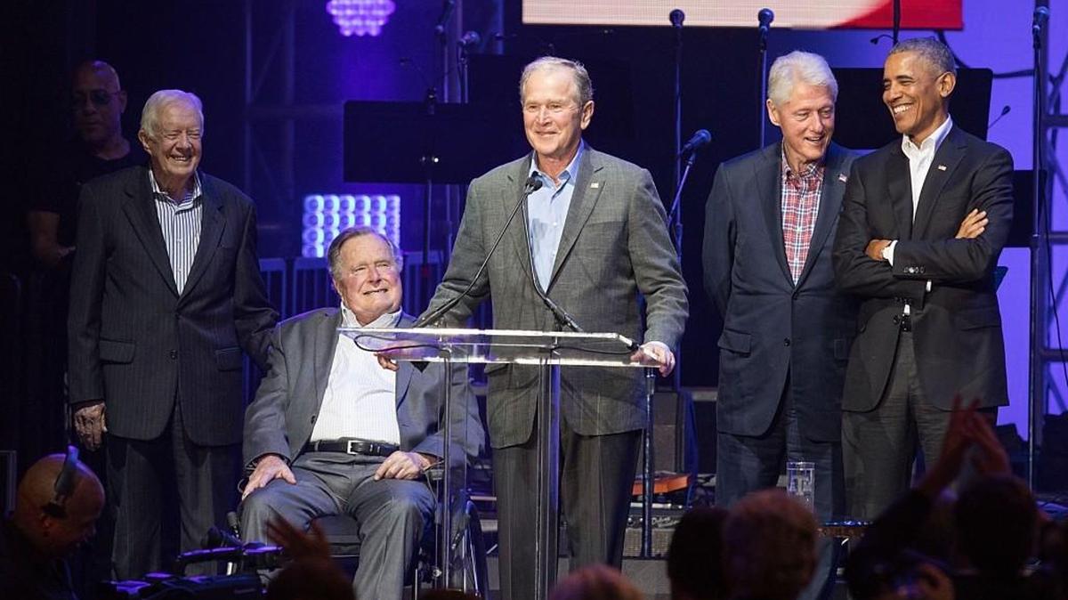 COLLEGE STATION, TX - OCTOBER 21: (L-R) Former United States Presidents Jimmy Carter, George H.W. Bush, George W. Bush, Bill Clinton, and Barack Obama address the audience during the 'Deep from the Heart: The One America Appeal Concert' at Reed Arena on the campus of Texas A&M University on October 21, 2017 in College Station, Texas.