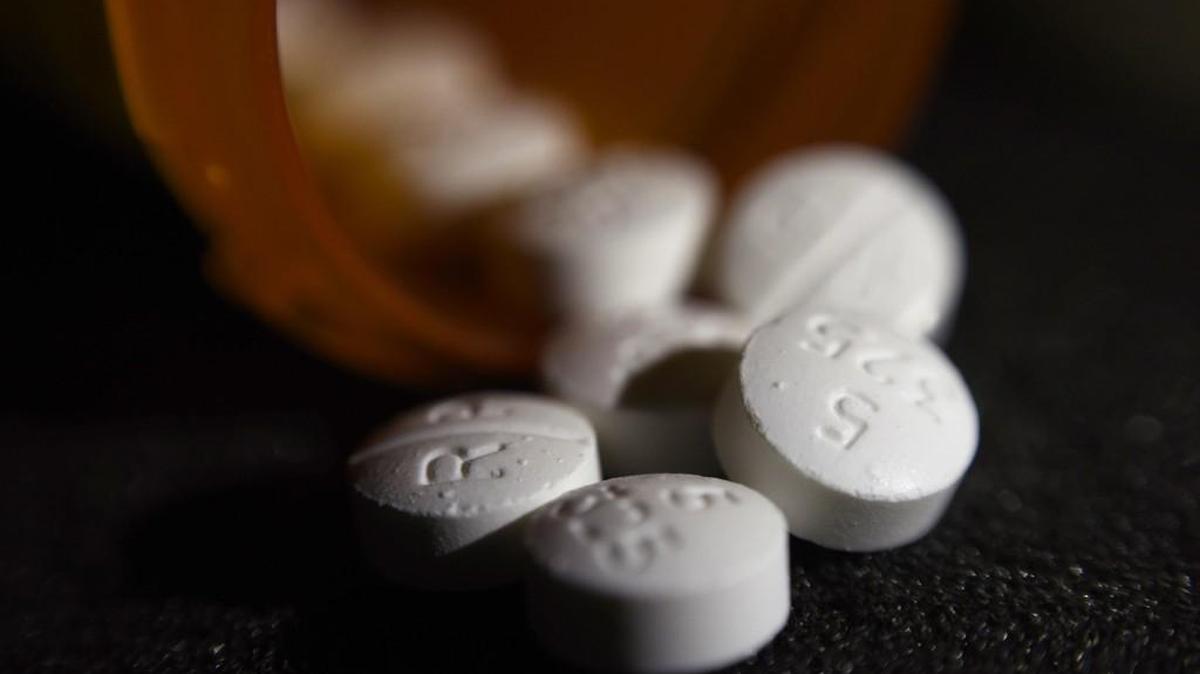 A file photo shows an arrangement of pills of the opioid oxycodone-acetaminophen.
