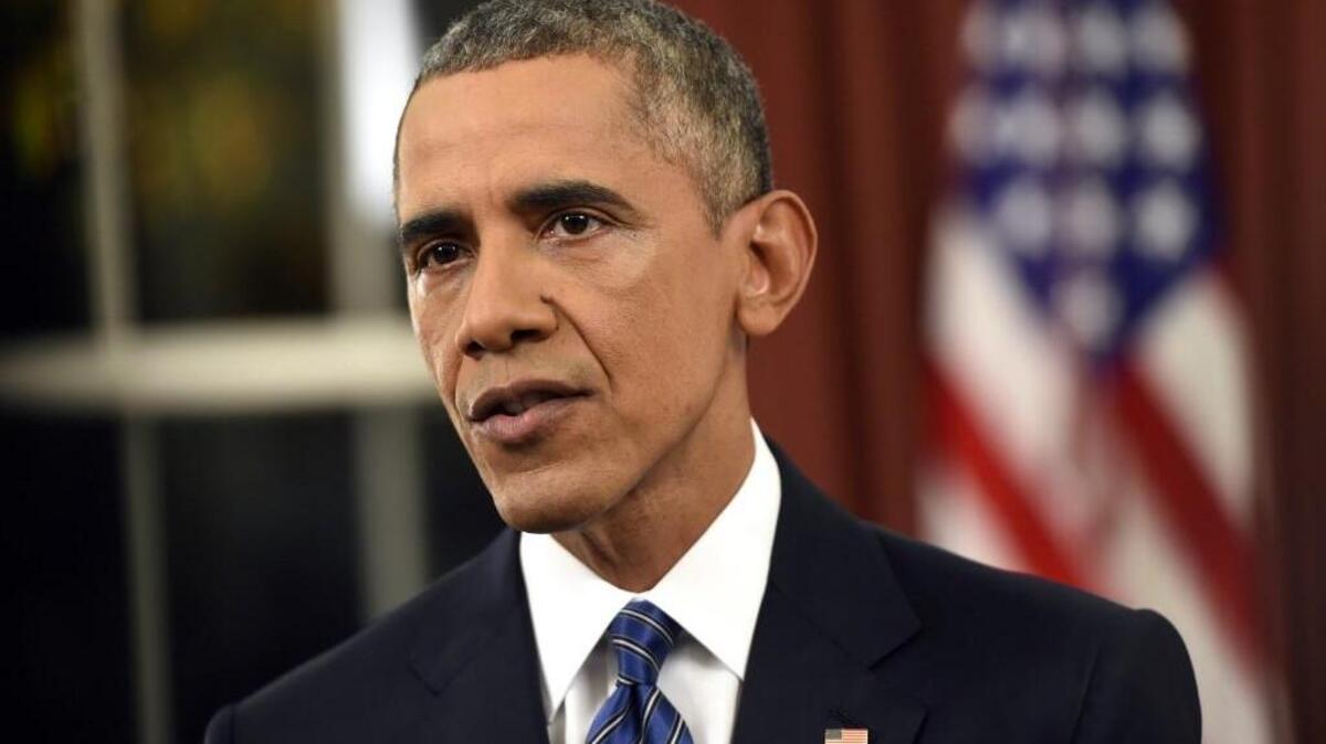 Barack Obama addresses the nation from the Oval Office at the White House in Washington.