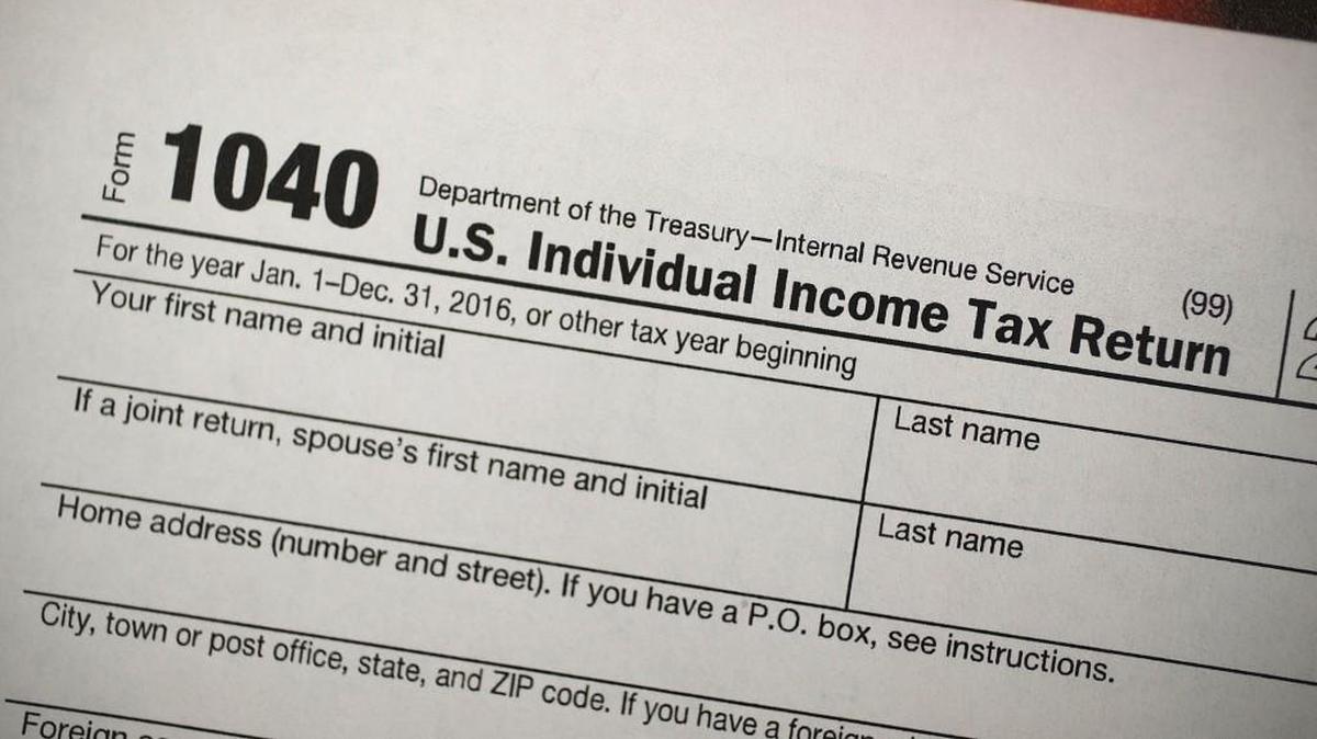 A copy of a IRS 1040 tax form is seen at an H&R Block office on December 22, 2017 in Miami, Florida.