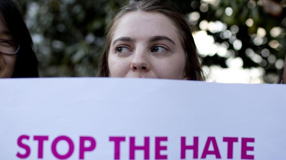 Naomi Carbrey holds a sign during a protest against House Bill 2 outside of the Governor’s Mansion on North Blount Street in downtown Raleigh.