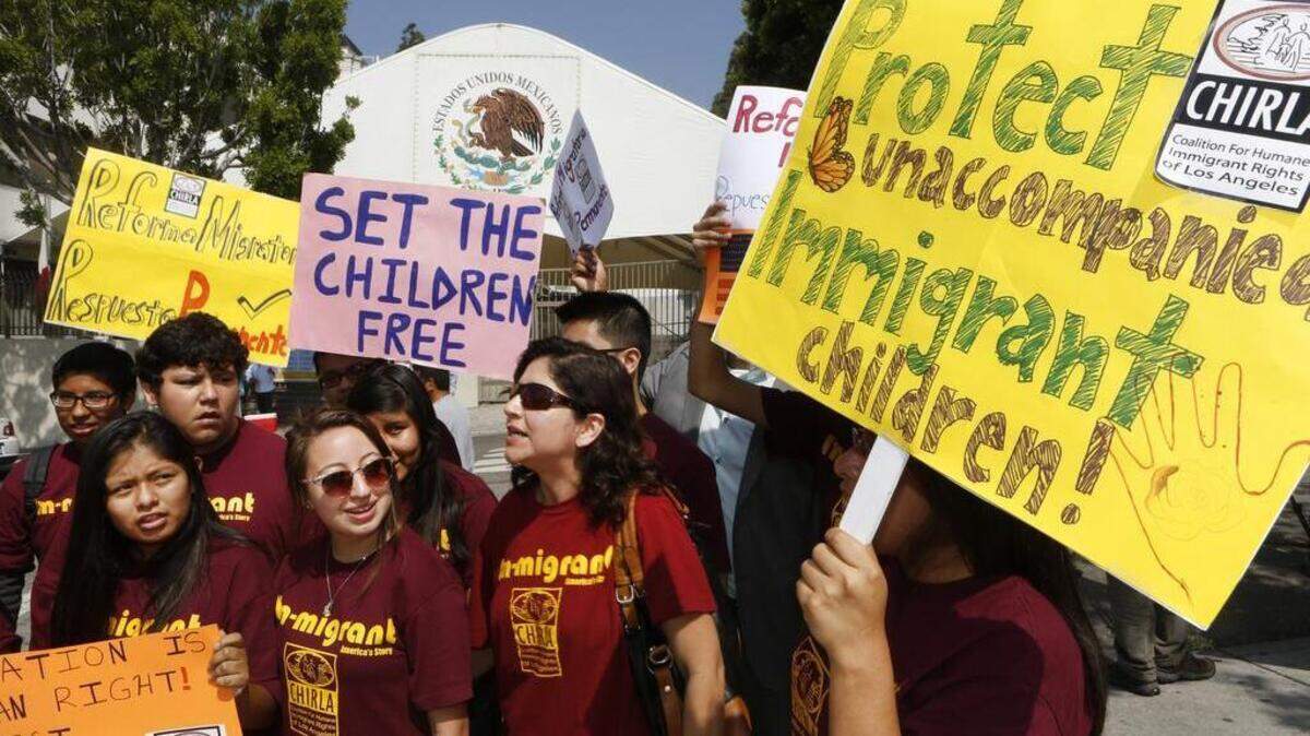 Immigration activists with Coalition for Humane Immigrant Rights of Los Angeles (CHIRLA) demand the Mexican government take more measures to protect and respect the rights of unaccompanied minors and families crossing Mexico's territory, during a protest outside the Mexican consulate in Los Angeles Thursday, July 3, 2014.