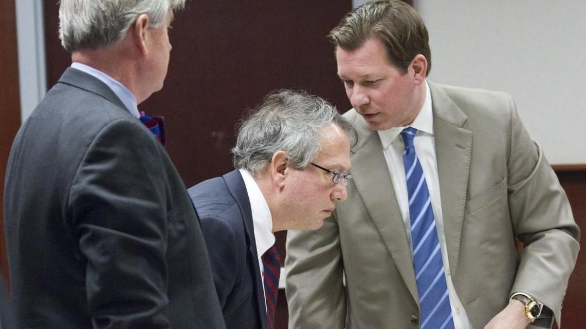 Attorneys representing groups supporting the Voter ID law Alexander Peters, left, Thomas Farr, center, and Phil Strach confer during a break as a hearing is held to determine whether the Voter ID law requires a change to the N.C. Constitution in a Wake County courtroom on Jan. 30, 2015.