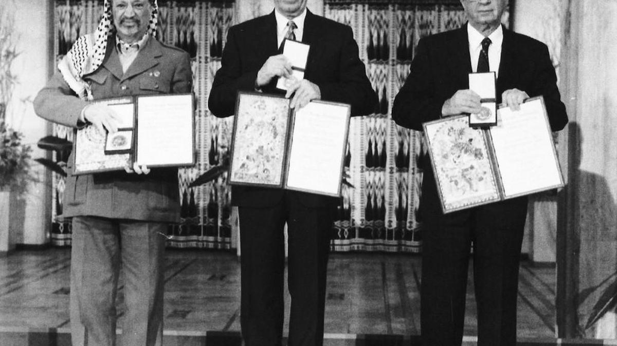 From left, PLO leader Yasser Arafat, Israeli Prime Minister Yitzhak Rabin and Israeli Foreign Minister Shimon Peres pose with their medals and diplomas after receiving the 1994 Nobel Peace Prize in Oslo’s City Hall. The three men received the prize for “for their efforts to create peace in the Middle East.” The award was designed to give a boost to peace efforts in the Middle East. It didn’t. The process collapsed and Rabin was assassinated the following year by an ultra-nationalist Israeli who opposed his peace moves.