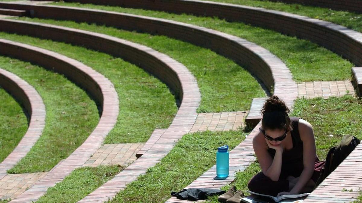 A Meredith College student reads in the amphitheater on the school’s campus. Kristin Lozoya says such times of reflection were an important part of attending the summer Governor’s School program at Meredith.