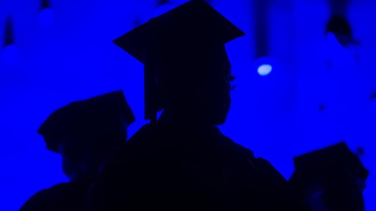 Members of the graduating class and faculty attend the Savannah College of Art and Design commencement in Atlanta.