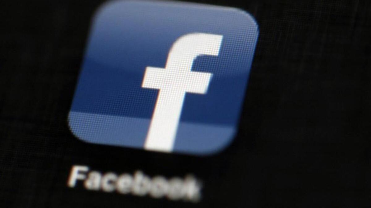In this May 16, 2012, file photo, the Facebook logo is displayed on an iPad in Philadelphia. Facebook is under fire for failing to rein in fake and biased news stories that some believe may have swayed the presidential election. Its predicament stems from this basic conundrum: It exercises great control over the news its users see, but it declines to assume the editorial responsibility that traditional publishers do.