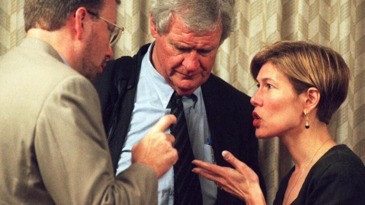In 1999, Ken Wright, left, a lobbyist for Blue Cross/Blue Shield has a discussion with ACLU lobbyist Deborah Ross, right, regarding legislation that would require insurance companies to offer reimbursement for birth control pills and other contraceptives. Marvin Musslewhite, center, is a lobbyist for the North Carolina Association of OBGYNs.