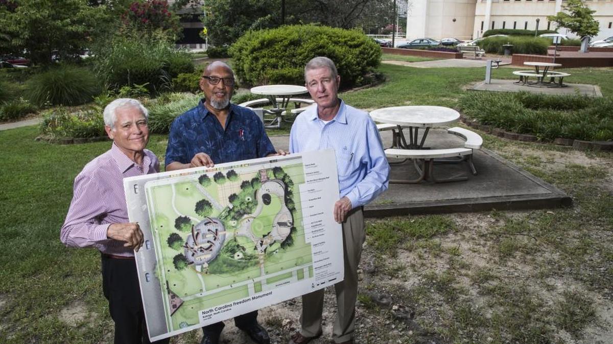 
David Warren, left, Reginald Hodges and Kel Landis are working to secure funding for the North Carolina Freedom Monument Park at the intersection of East Lane and North Wilmington streets in downtown Raleigh.
