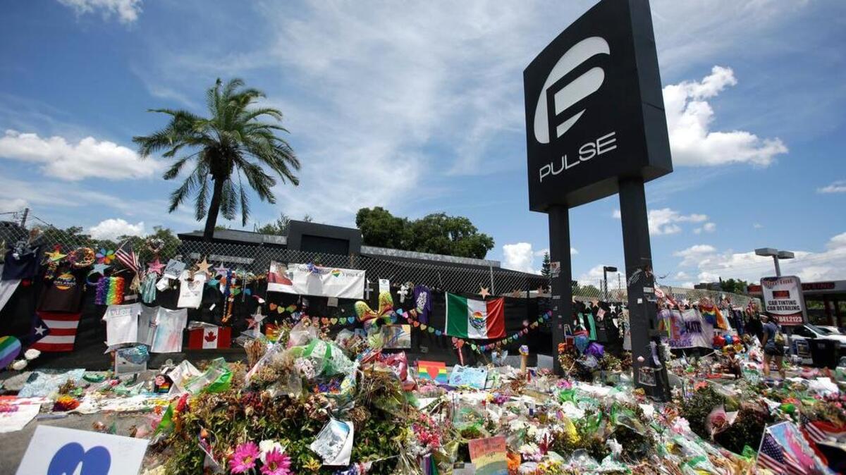 This July 11 photo shows a makeshift memorial outside the Pulse nightclub, a month after the mass shooting in Orlando, Fla.