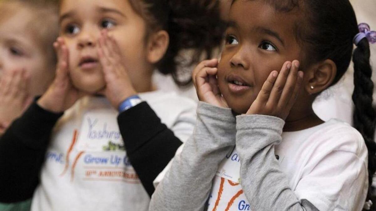 
Preschoolers participate in a sing-along at the Experience Children’s Museum in Erie, Pa., as part of a Grow Up Great school reading program.
