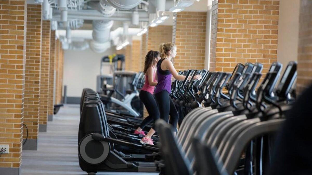 In this photo students exercise at the fitness center in Duncan Hall, which is attached to the west side of Notre Dame Stadium, in South Bend, Ind.